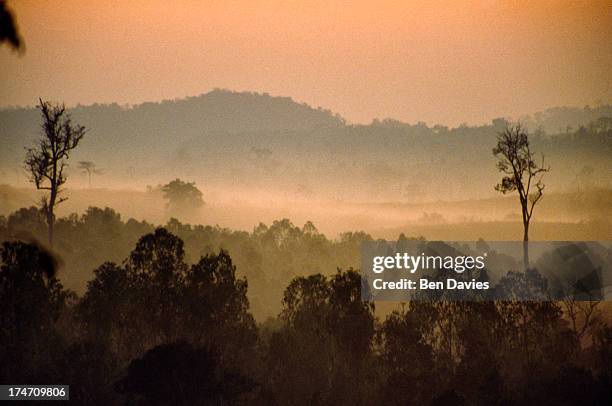 Dawn over the misty mountains of Nong Khai Province near the hilltop retreat at Wat Phu Tok in northeast Thailand. The country's tropical climate and...