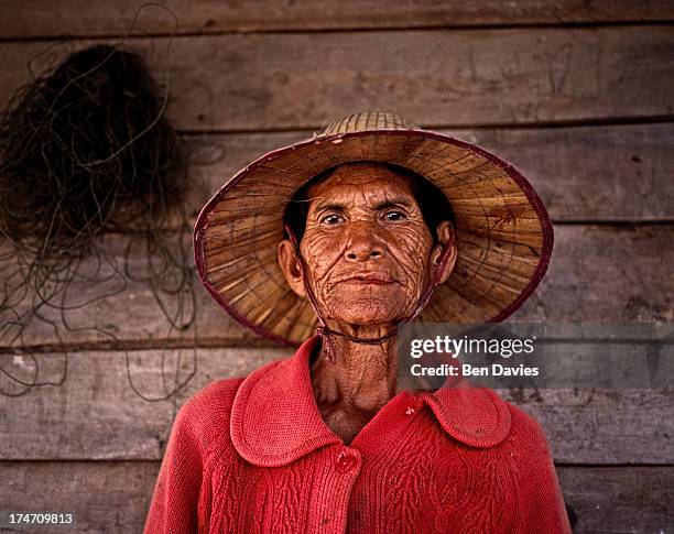 Portrait of a rice farmer in the poor rural area to the northeast of Bangkok in the region known as Isaan. Despite rapid industrialization, rice...
