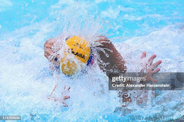 Zivko Gocic of Serbia in action with Ramiro Georgescu of Romania during the Men's Water Polo quarterfinals qualification match between Serbia and...