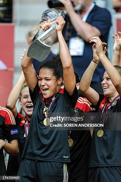 Germany's Celia Okoyino Da Mbabi celebrates with the trophy after winning the UEFA Women's European Championship Euro 2013 final Germany vs Norway on...