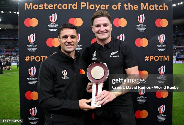 The MASTERCARD Player of the Match, Jordie Barrett of New Zealand, is presented with a Trophy by Dan Carter, former New Zealand rugby player, after...