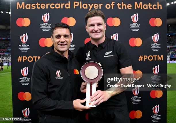 The MASTERCARD Player of the Match, Jordie Barrett of New Zealand, is presented with a Trophy by Dan Carter, former New Zealand rugby player, after...