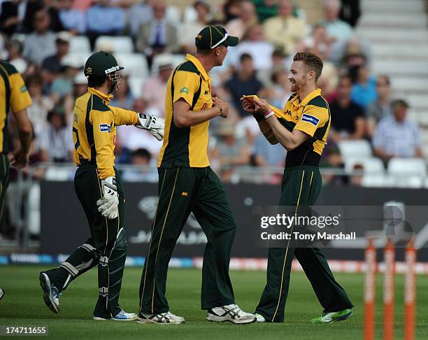 Graeme White of Nottinghamshire Outlaws celebrates taking the wicket of Kabir Ali of Lancashire Lightning during the Friends Life T20 match between...
