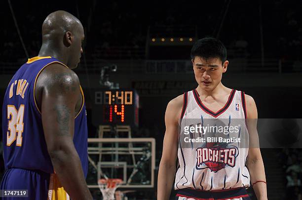 Yao Ming of the Houston Rockets faces off against Shaquille O'Neal of the Los Angeles Lakers during the NBA game at Compaq Center on January 17, 2003...