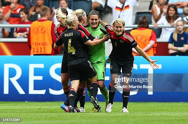 Nadine Angerer , goalkeeper of Germany celebrate with her team mates Saskia Bartusiak and Annike Krahn after the UEFA Women's EURO 2013 final match...