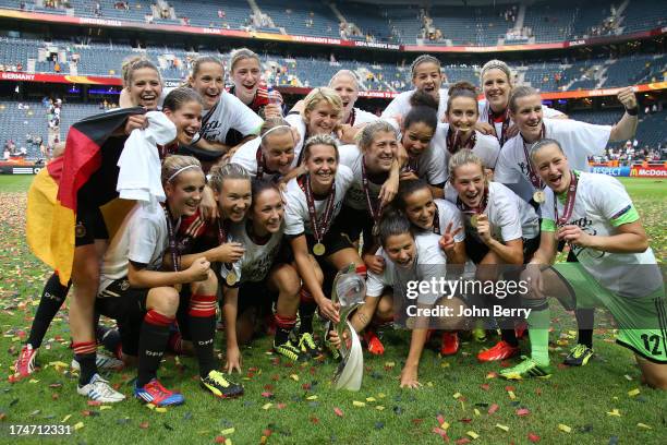 German players celebrate Germany's victory after the UEFA Women's Euro 2013 Final between Germany and Norway at the Friends Arena Stadium on July 28,...