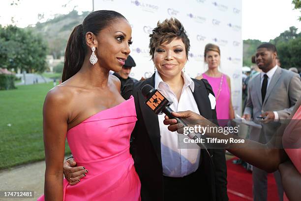 Holly Robinson Peete and actress Tisha Campbell-Martin attend the 15th Annual DesignCare benefiting The HollyRod Foundation on July 27, 2013 in...