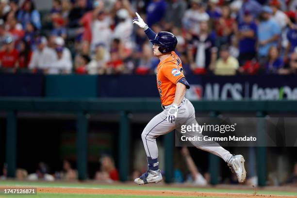 Alex Bregman of the Houston Astros celebrates as he rounds the bases after hitting solo home run against Jordan Montgomery of the Texas Rangers...