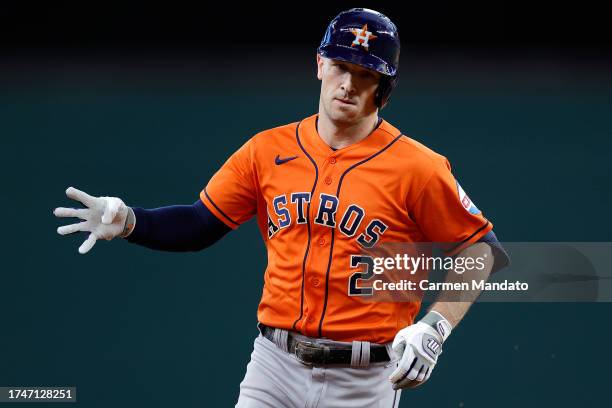 Alex Bregman of the Houston Astros celebrates as he rounds the bases after hitting solo home run against Jordan Montgomery of the Texas Rangers...