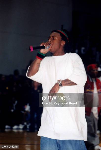 Rapper Lil Wayne performs during the 'Hoop Magic Charity Celebrity Basketball Game and Concert' at Philips Arena in Atlanta, Georgia in February 2003.