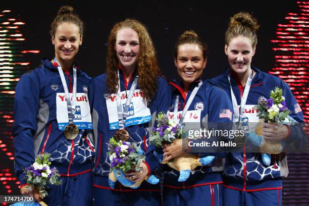 Gold Medal winners Megan Romano, Shannon Vreeland, Natalie Coughlin and Missy Franklin of the USA celebrate on the podium after the Swimming...