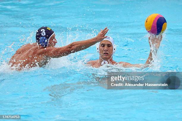 Marton Vamos of Hungary in action with Yevgeniy Medvedev of Kazakhstan during the Men's Water Polo quarterfinals qualification match between Hungary...