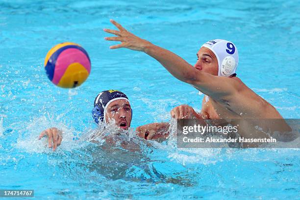 Daniel Varga of Hungary in action with Vladimir Ushakov of Kazakhstan during the Men's Water Polo quarterfinals qualification match between Hungary...