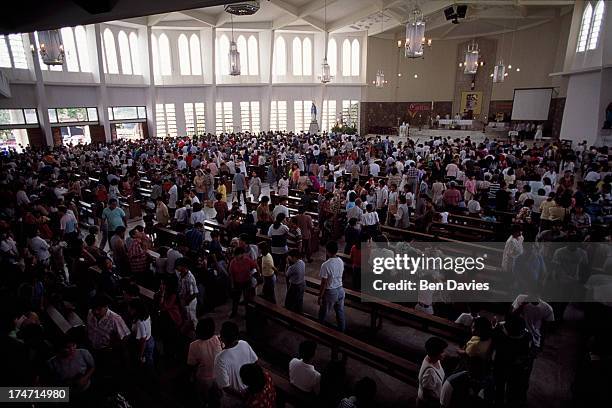 Catholic church service held to celebrate Easter Sunday at the roman catholic cathedral in Dagupan in the Phillipines. Throughout the Philippines,...