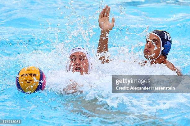 Balasz Harai of Hungary in action with Mikhail Ruday of Kazakhstan during the Men's Water Polo quarterfinals qualification match between Hungary and...