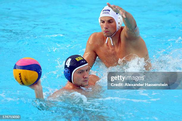 Denes Varga of Hungary in action with Roman Pilipenko of Kazakhstan during the Men's Water Polo quarterfinals qualification match between Hungary and...