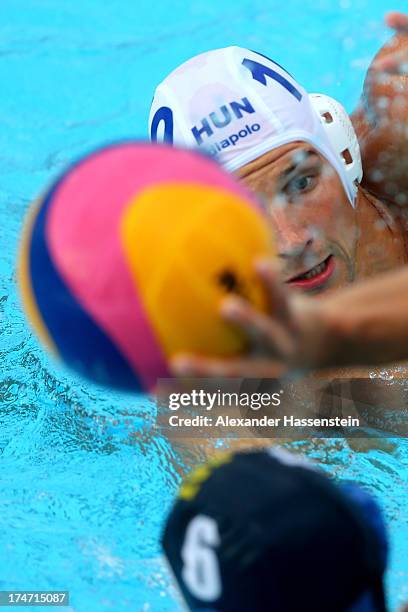 Denes Varga of Hungary in action with Anton Koliadenko of Kazakhstan during the Men's Water Polo quarterfinals qualification match between Hungary...