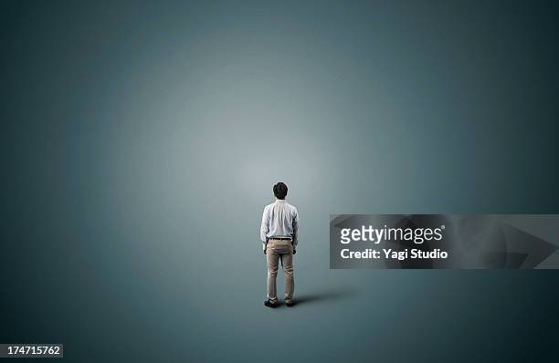 man is standing - rear view stock pictures, royalty-free photos & images