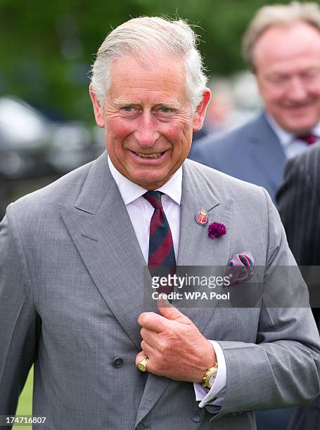 Prince Charles, Prince of Wales presents the Westchester Cup at the Audi International Polo at Guards Polo Club on July 28, 2013 in Egham, England.