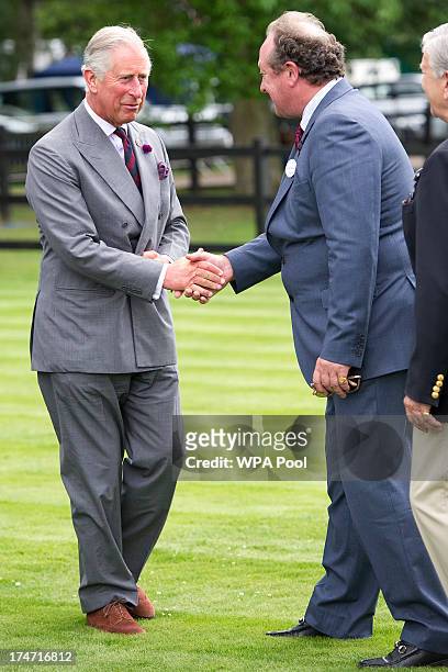 Prince Charles, Prince of Wales meets Neil Hobday, CEO Guards Polo Club at the Audi International Polo at Guards Polo Club on July 28, 2013 in Egham,...