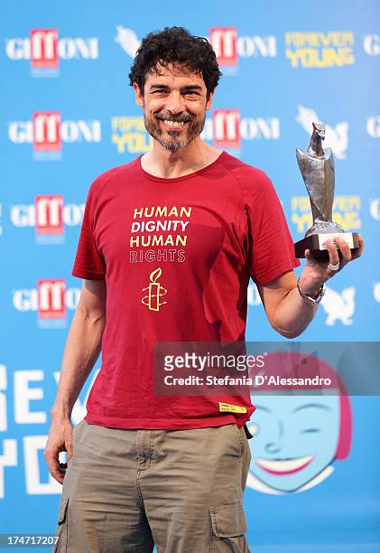 Alessandro Gassman poses with the Giffoni Award during 2013 Giffoni Film Festival on July 28, 2013 in Giffoni Valle Piana, Italy.