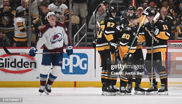 Lars Eller of the Pittsburgh Penguins celebrates with teammates after scoring a goal in the second period during the game against the Colorado...