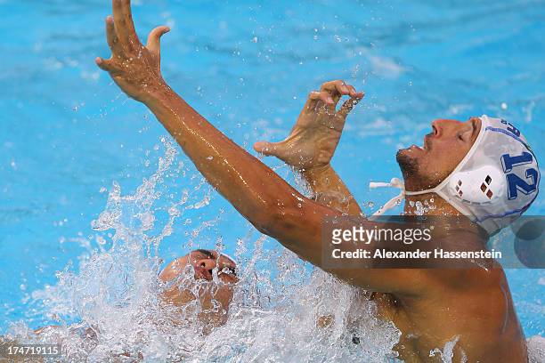 Christian Napolitano of Italy in action with Zhongxing Liang of China during the Men's Water Polo quarterfinals qualification match between Italy and...