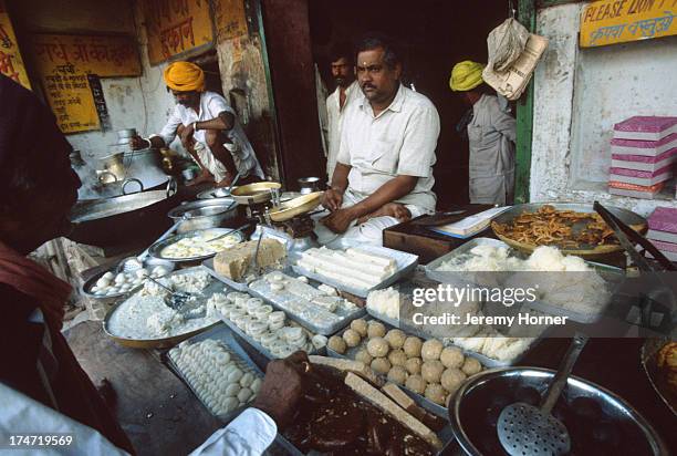 Streetside stall selling milk sweets in Ajmer, Rajasthan..