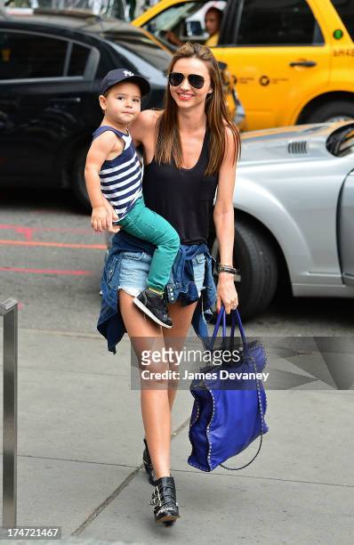 Miranda Kerr and son Flynn Bloom arrive to FAO Schwarz on July 28, 2013 in New York City.