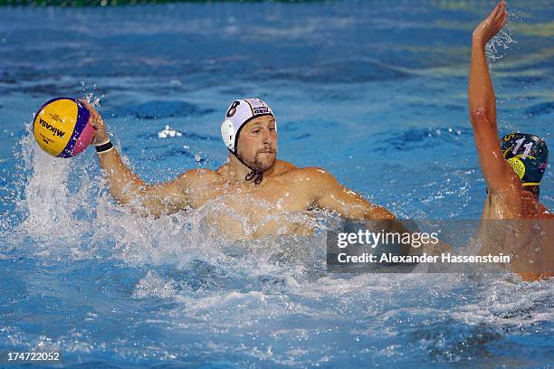 Paul Schueler of Germany in action with Rhys Howden of Australia during the Men's Water Polo quarterfinals qualification match between Germany and...