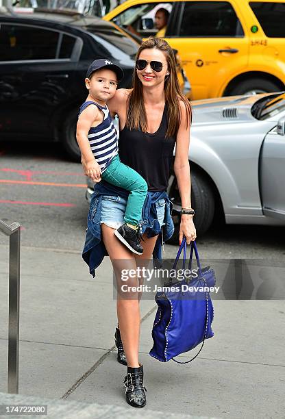 Miranda Kerr and son Flynn Bloom arrive to FAO Schwarz on July 28, 2013 in New York City.