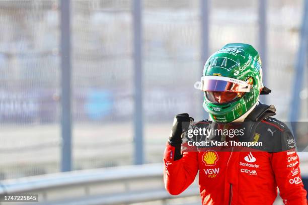 Pole position qualifier Charles Leclerc of Monaco celebrates in parc ferme during qualifying ahead of the F1 Grand Prix of United States at Circuit...