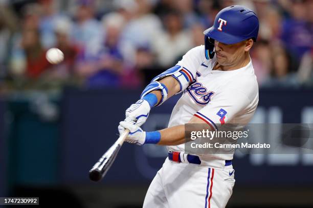 Nathaniel Lowe of the Texas Rangers hits a solo home run against Justin Verlander of the Houston Astros during the fifth inning in Game Five of the...