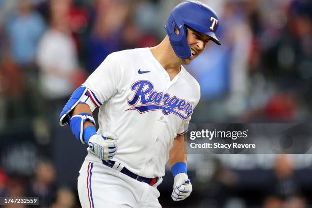 Nathaniel Lowe of the Texas Rangers celebrates after hitting a solo home run against Justin Verlander of the Houston Astros during the fifth inning...