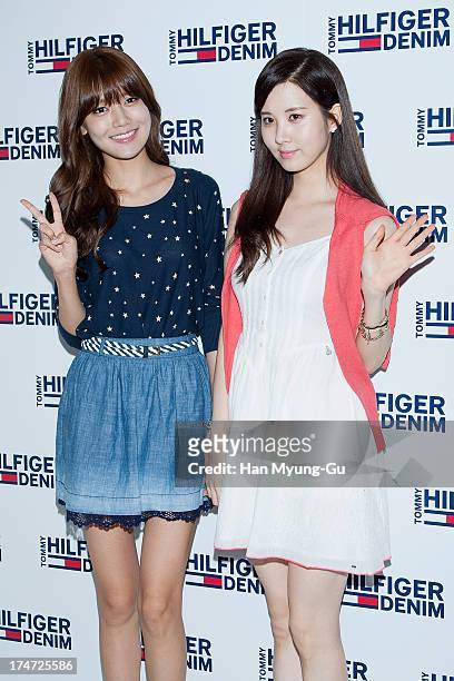 Sooyoung and Seohyun of South Korean girl group Girls' Generation attend an autograph session for the 'Tommy Hilfiger Denim' at Hyundai Department...