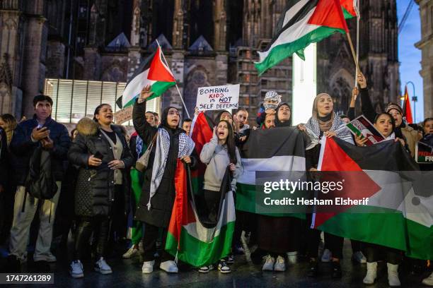 Pro-Palestinian demonstrators gather to show support and condemn the Israeli attacks in Gaza on October 20, 2023 in Cologne, Germany. The bombardment...