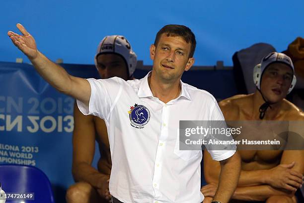 Nebojsa Novoselac, head coach of Germany reacts during the Men's Water Polo quarterfinals qualification match between Germany and Australia during...