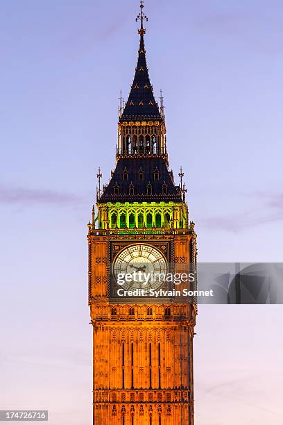 london, big ben illuminated at dusk - big ben stock pictures, royalty-free photos & images