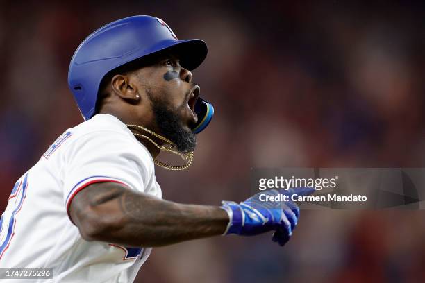 Adolis Garcia of the Texas Rangers celebrates after hitting a three run home run against Justin Verlander of the Houston Astros during the sixth...