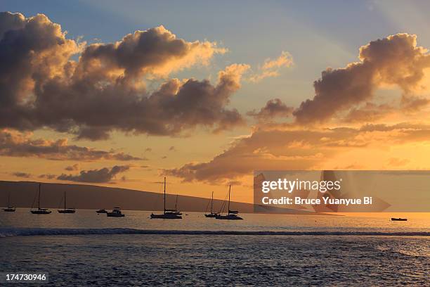 sunset in ocean front of lahaina - lanai stock pictures, royalty-free photos & images