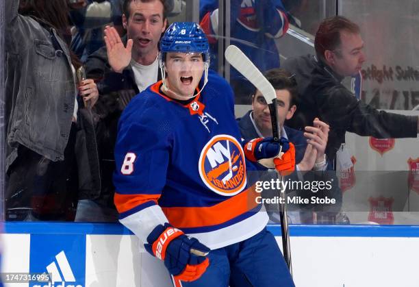 Noah Dobson of the New York Islanders celebrates after scoring a goal against the Ottawa Senators during the third period at UBS Arena on October 26,...