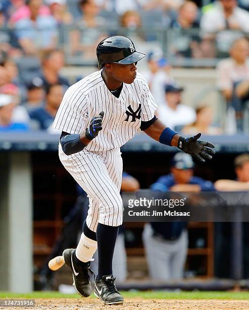 Alfonso Soriano of the New York Yankees celebrates his ninth inning game winning base hit against the Tampa Bay Rays at Yankee Stadium on July 28,...
