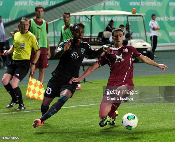 Kanu of FC Terek Grozny challenges Ivan Marcano of FC Rubin Kazan for the ball during the Russian Premier League match between FC Terek Grozny and FC...