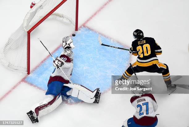 Lars Eller of the Pittsburgh Penguins scores past Alexandar Georgiev of the Colorado Avalanche at PPG PAINTS Arena on October 26, 2023 in Pittsburgh,...