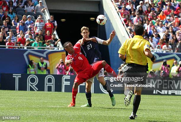 Gabriel Torres of Panama and Clarence Goodson of USA fight for the ball in the first half at the 2013 CONCACAF Gold Cup Final at Soldier Field July...