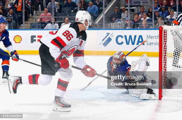 Ilya Sorokin of the New York Islanders makes the first period save on Jack Hughes of the New Jersey Devils at UBS Arena on October 20, 2023 in...