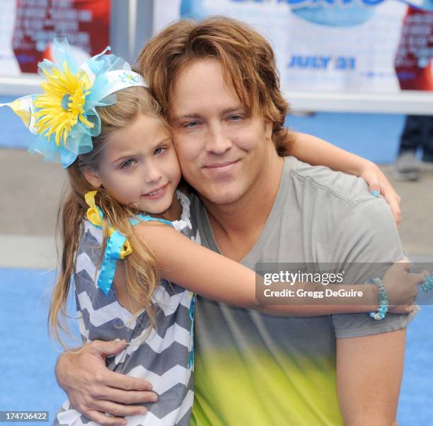 Larry Birkhead and daughter Dannielynn Birkhead arrive at the Los Angeles premiere of "Smurfs 2" at Regency Village Theatre on July 28, 2013 in...