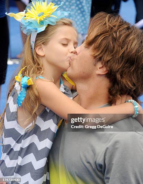 Larry Birkhead and daughter Dannielynn Birkhead arrive at the Los Angeles premiere of "Smurfs 2" at Regency Village Theatre on July 28, 2013 in...