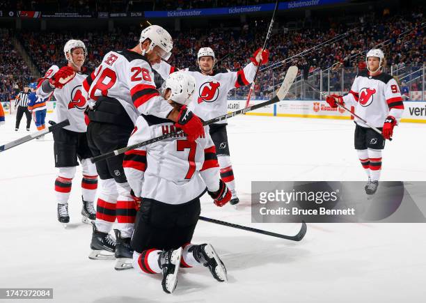 The New Jersey Devils celebrate a powerplay goal by Dougie Hamilton against the New York Islanders at 19:00 of the first period at UBS Arena on...