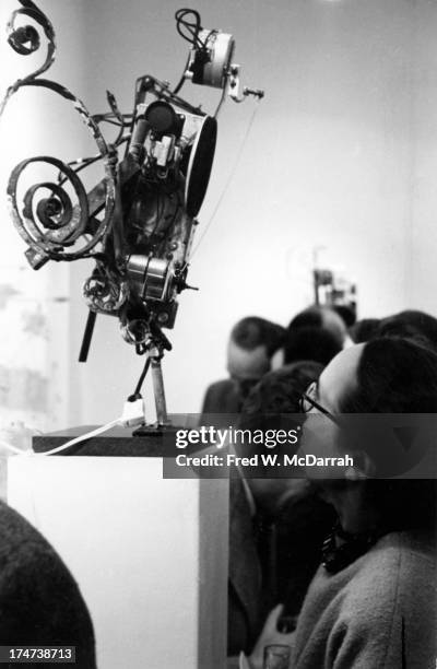 Patron looks at a sculpture in an unspecified gallery, New York, New York, November 1962.